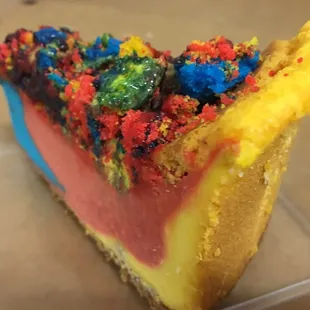 Thick and creamy multiflavored Superman cheesecake at Lucki's Cheesecakes on 6 mile