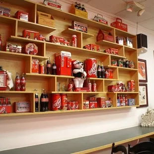 a shelf of coca colas