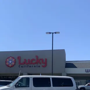 a white van parked in front of a building