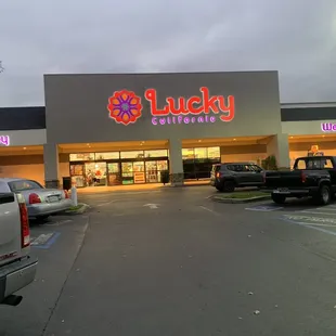 a parking lot with cars parked in front of it