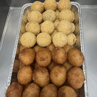 a tray of fried doughnuts