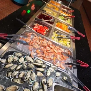 a buffet of seafood and salads
