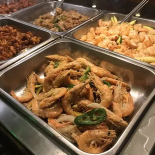 a variety of food items in a buffet