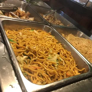 a variety of food in a buffet