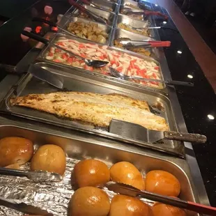 a buffet with many different types of food