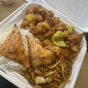 Combo plate with,white rice, chow mein, and Crispy Orange Chicken, and Fried Crab-Cheese Puffs