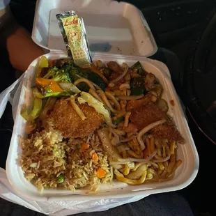 a take out container of chinese food