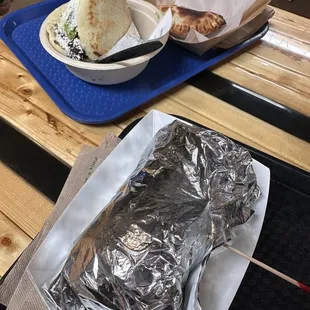 a burrito and a burrito on a tray