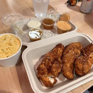 3 piece tenders side of mac, and the following sauces from left to right: Honey mustard, honey butter, habanero honey, paprika aioli