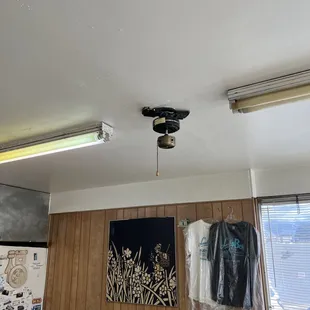 a ceiling fan and a bed