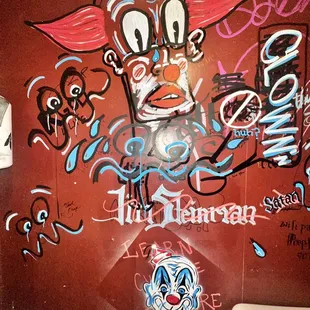 a toilet with graffiti on it