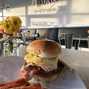 a burger and fries on a plate