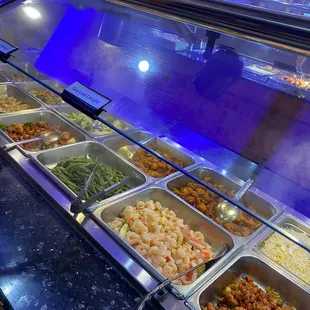 a variety of food items in a buffet
