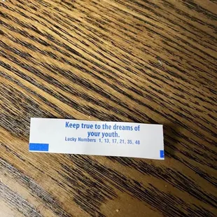 a sticker on a wooden table
