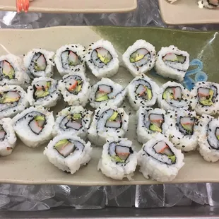 a platter of sushi rolls