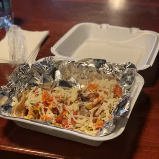 Carnita taco with cheddar cheese  corn salsa and pico