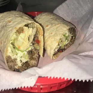 Steak Burrito (Mexican rice, queso fresco, lettuce, tomatoes, Morita Salsas)