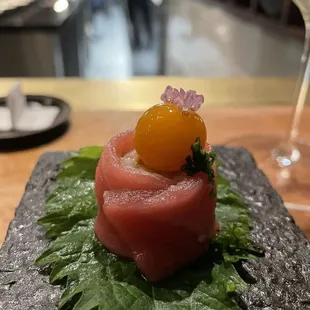 Toro with quail egg, shiso, chive flower