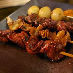 Chicken liver, chicken hearts, crispy chicken skin, and quail eggs