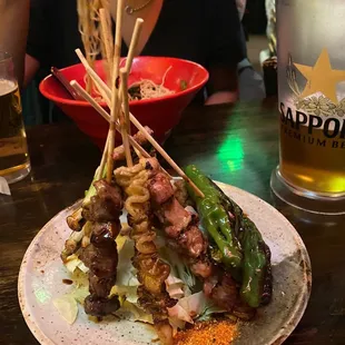 a plate of food and a glass of beer