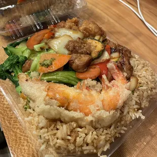 shrimp, broccoli, and rice in a plastic container
