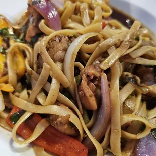 a plate of noodles and vegetables