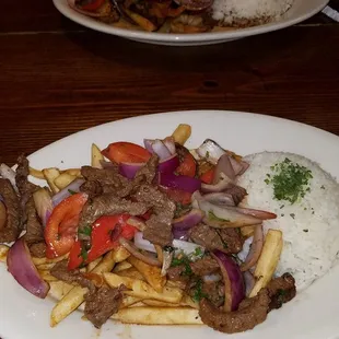 Lomo saltado and shrimp and chicken