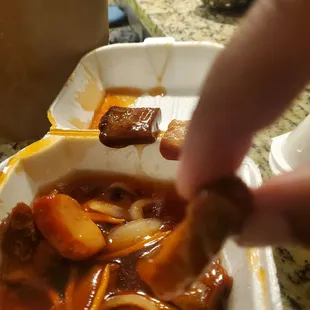 Rib tips!  Thin strips of pork floating in sauce.most of  the strips are just fat. I threw it out. Never had rib tip with no bone