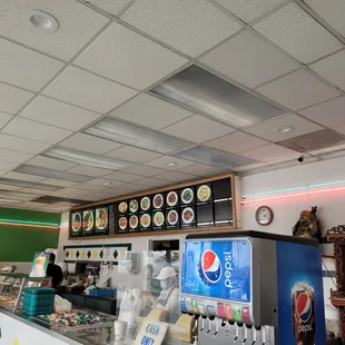 Lots of colorful pictures on the menu board.