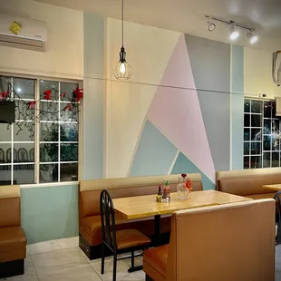 a restaurant with booths and tables