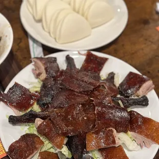 a plate of meat and vegetables on a table