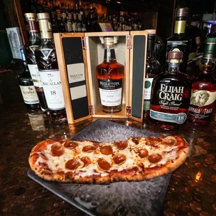 a pizza with pepperoni on it