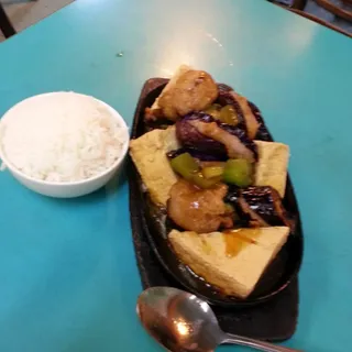 Bean Cake with Black Bean Sauce Over Rice