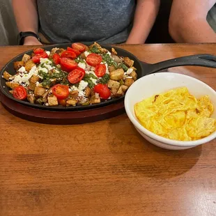 The farmers skillet with sausage and eggs on the side
