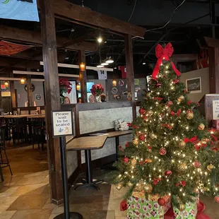 a decorated christmas tree in a restaurant