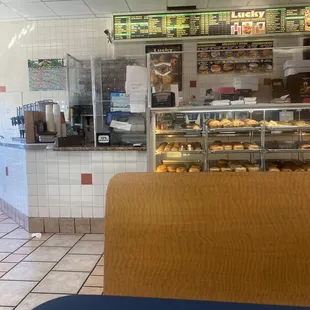 Service counter in center, donut display at right.