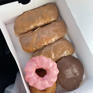 Maple bars, strawberry cruller, chocolate custard filled, and old fashioned