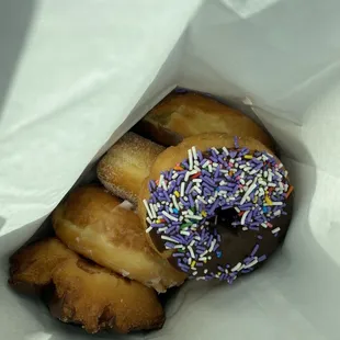 a bag of doughnuts with sprinkles