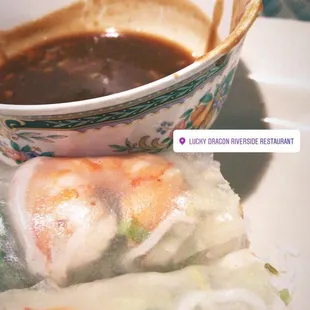 a bowl of soup and rolls