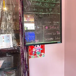 a menu on the wall of a restaurant