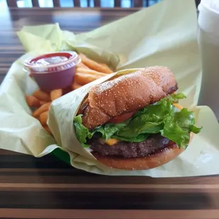 Let me introduce you to the Deluxe Cheeseburger which consists of mayo, lettuce, tomato, cheese and to top it off grilled onions!