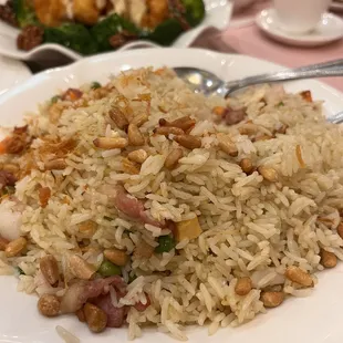 a plate of fried rice and broccoli