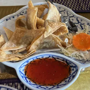 a bowl of chips and a bowl of sauce