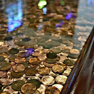 a table with a lot of coins on it
