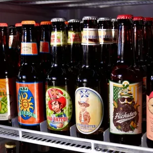 a fridge full of beer bottles