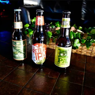 three bottles of beer on a table