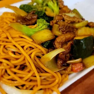 a plate of noodles and vegetables