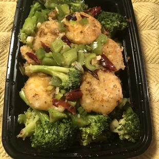 Peppersalt fried shrimp. 12 jumbo shrimps on a bed of broccoli and diced chili peppers and Sichuan peppers. Feb 2023