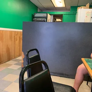 a woman sitting at a table in a restaurant