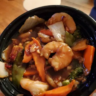 a person holding a bowl of food